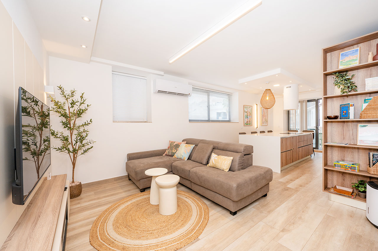 Wide view of kitchen and living area